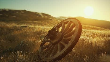 Old-wooden-wheel-on-the-hill-at-sunset